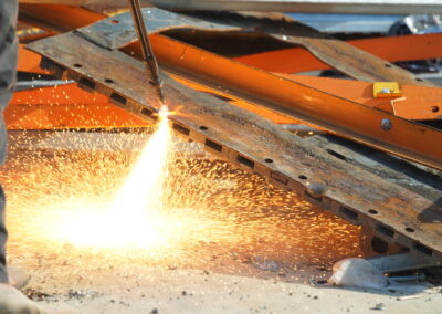 Scrap metal being cut by a gas torch